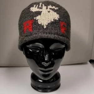 Gray knit hat with a white reindeer and red lettering displayed on a black mannequin head.
