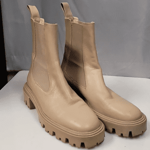 Beige chunky platform ankle boots with a rugged sole.