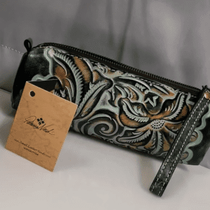 Embossed leather pencil case with strap.