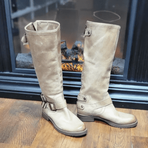 Pair of cream leather knee-high boots.