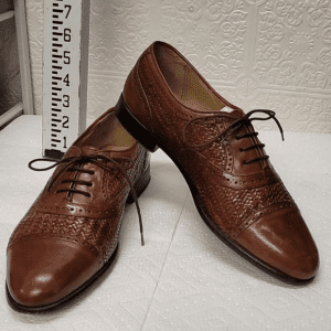 Brown leather woven lace-up shoes.