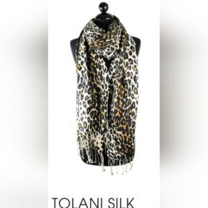 Leopard print sleeveless silk blouse on a mannequin.